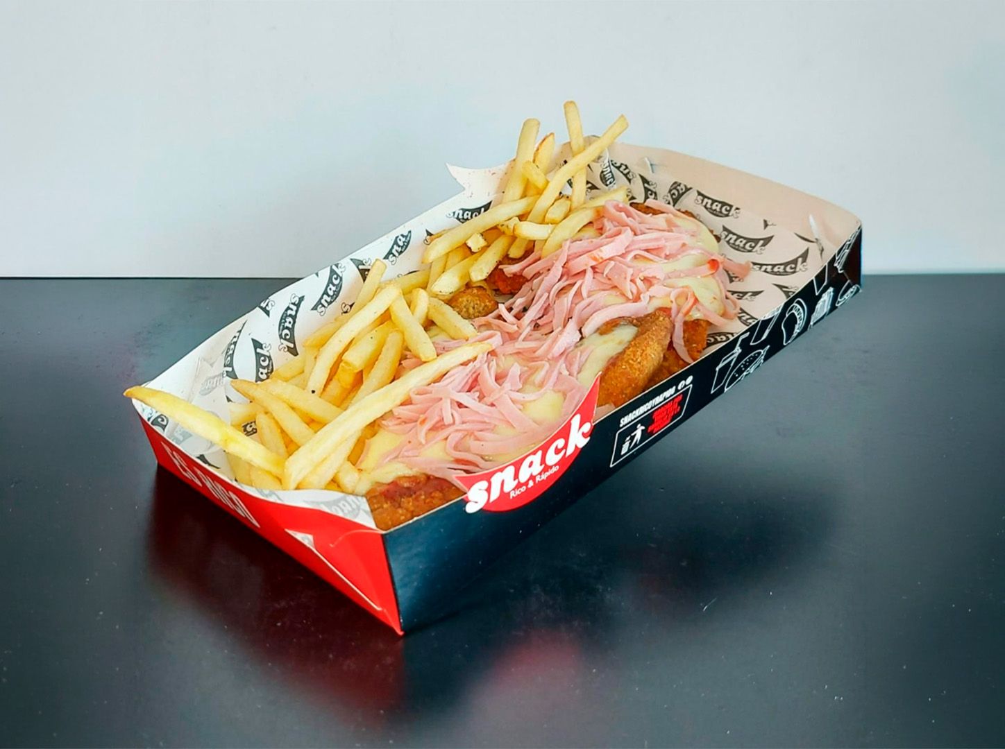 Milanesa especial con jamón más fritas