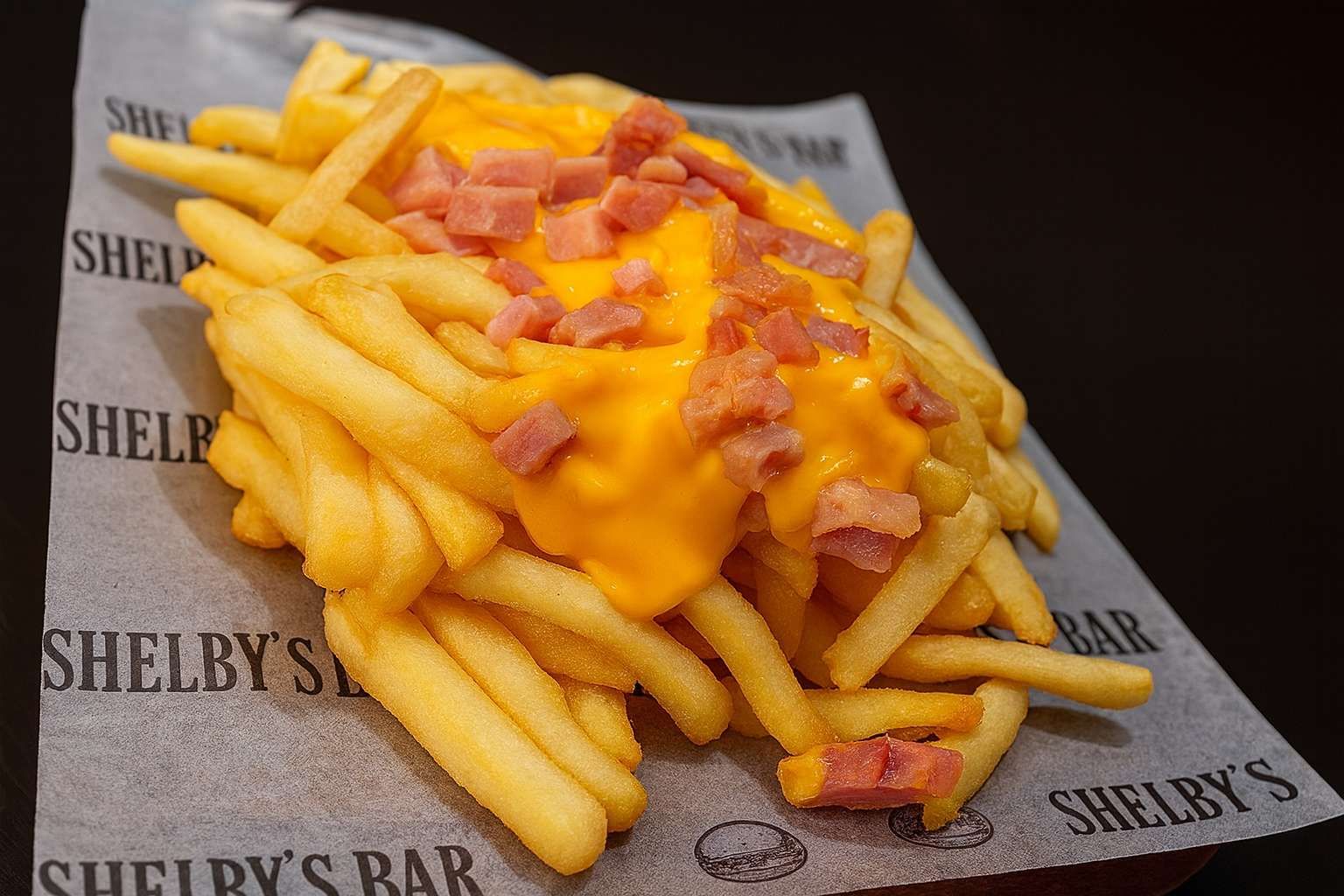 Fritas con cheddar y bacon