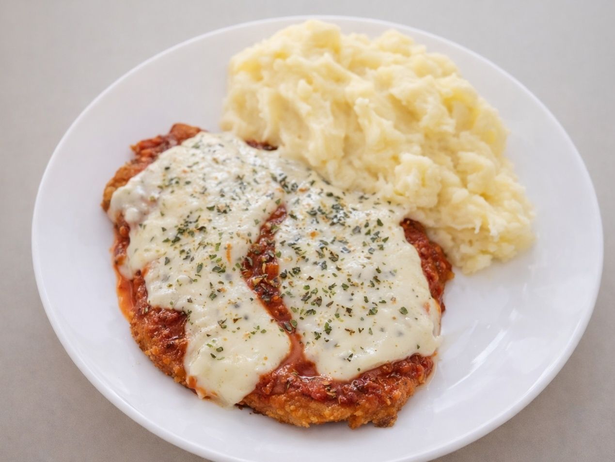 Milanesa de ternera a la pizza