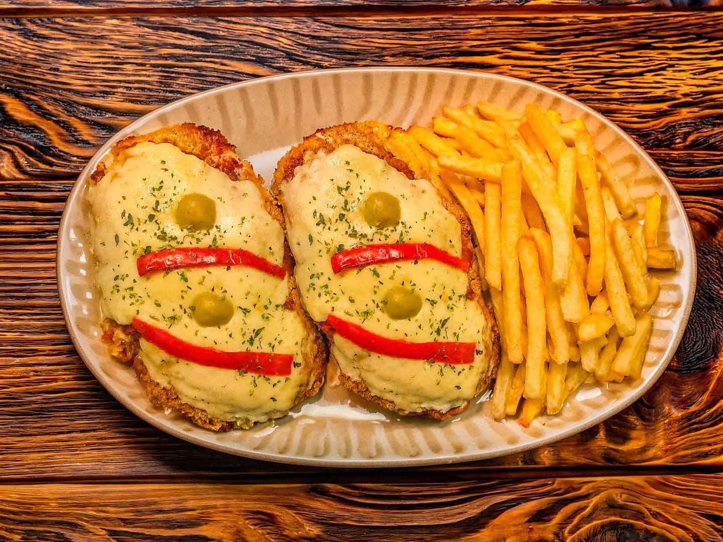 2x milanesa a la napolitana con papas fritas