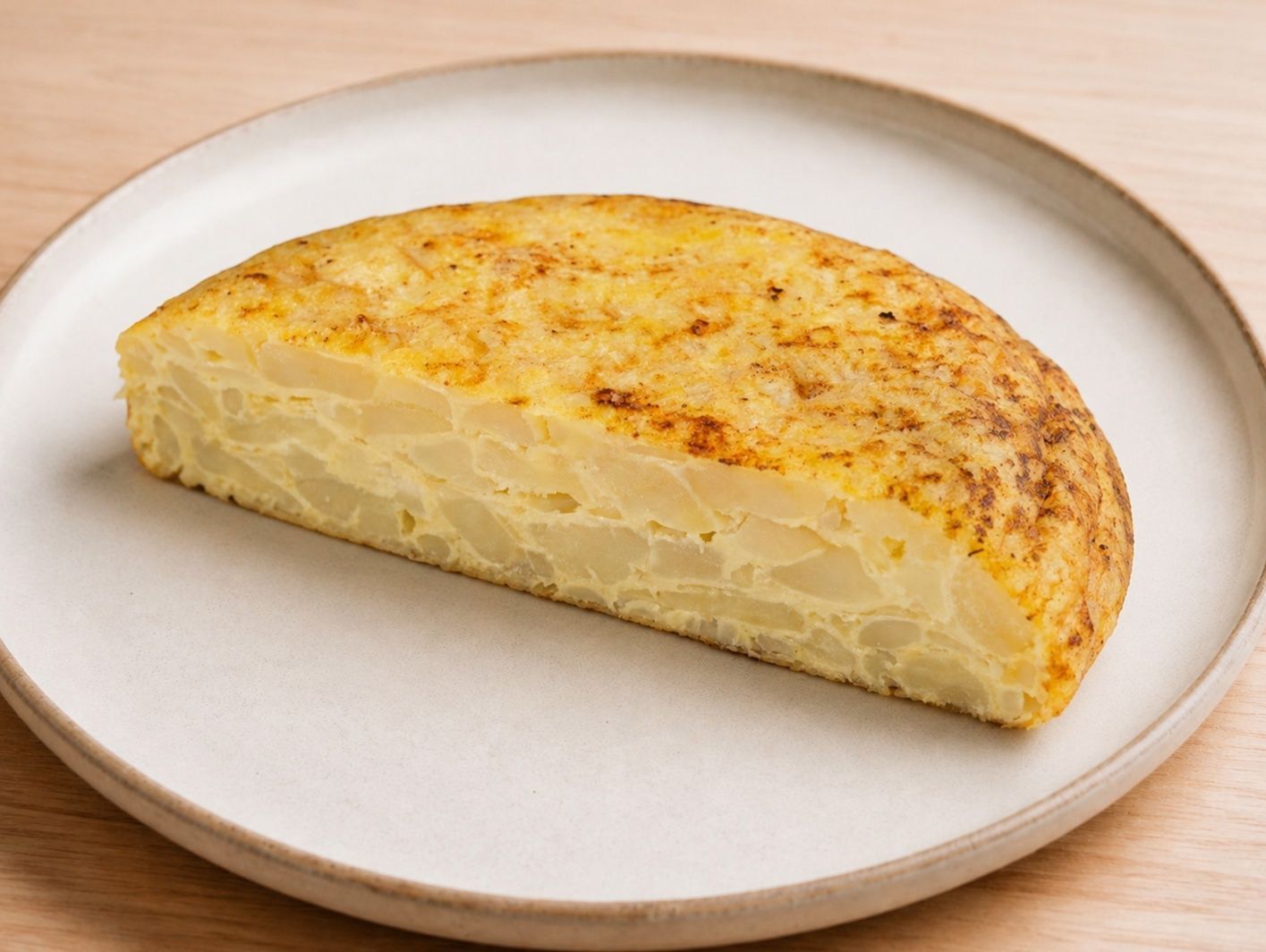 Mitad tortilla de papa y cebolla