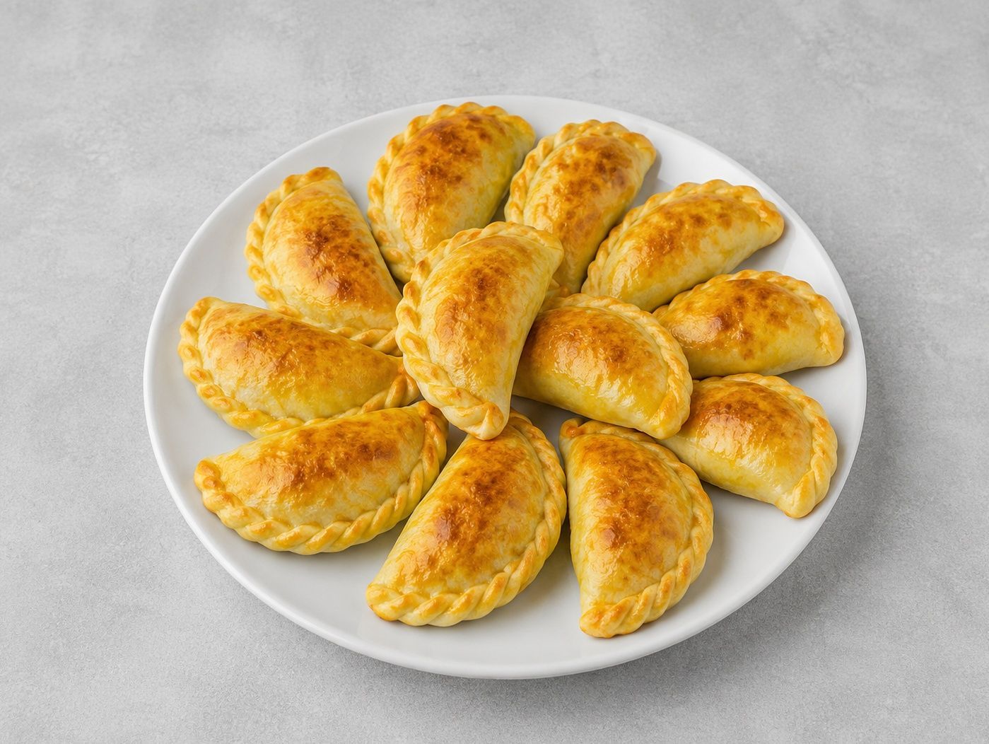 Docena de empanadas a elección.