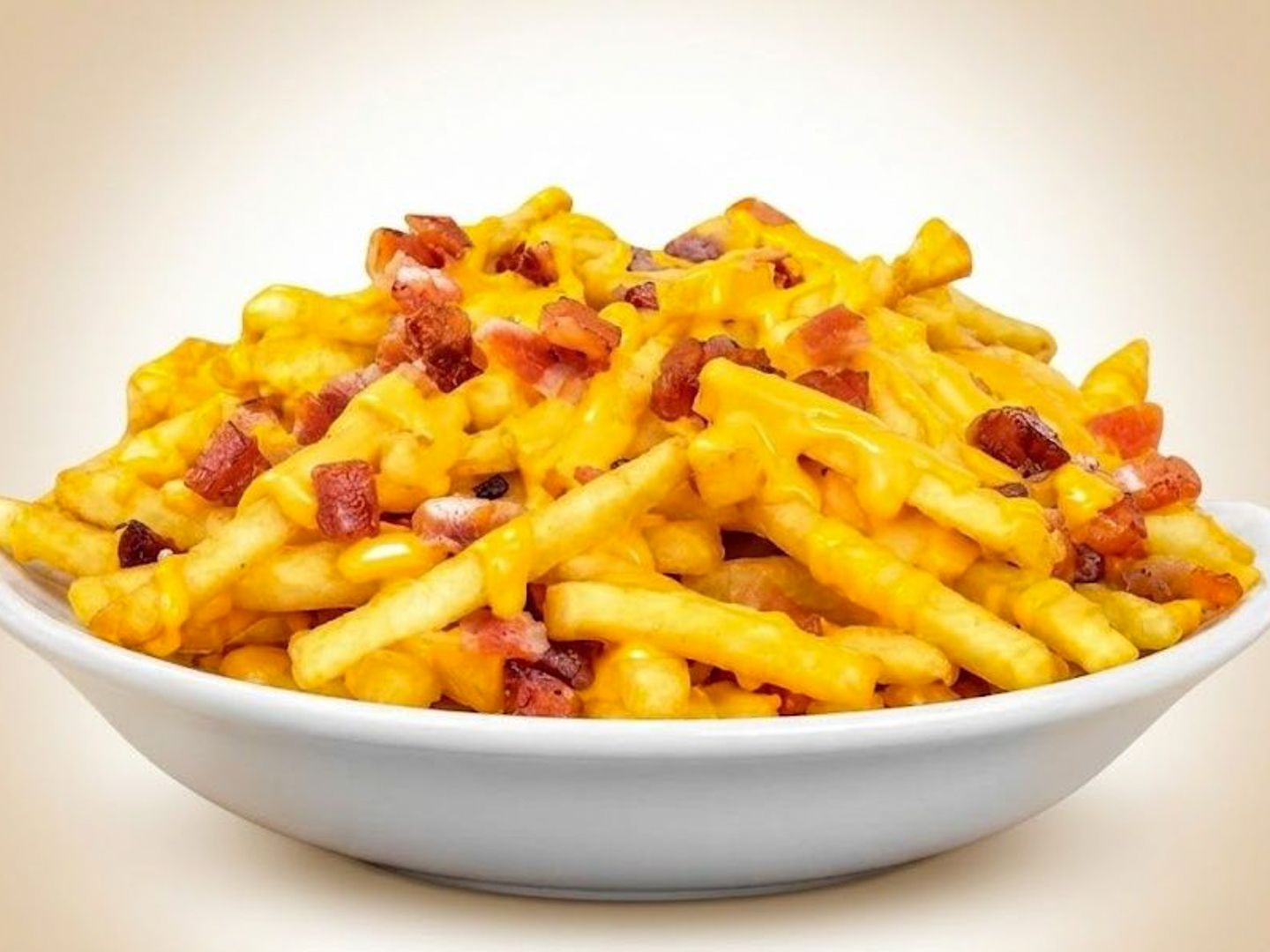 Papas con cheddar y bacon