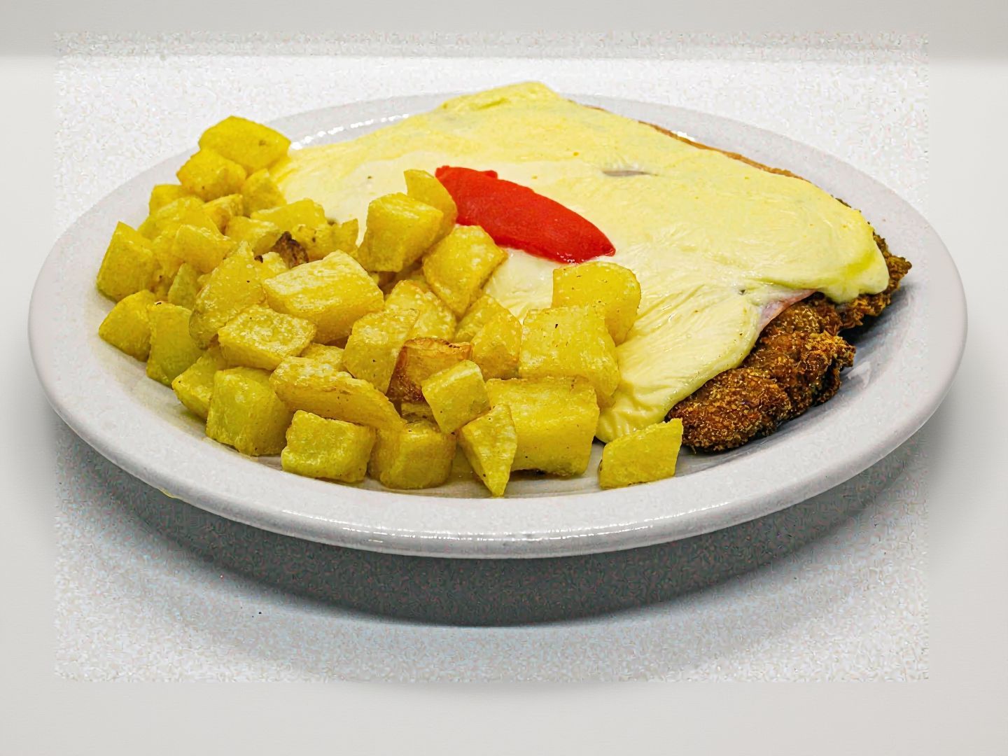 Milanesa napolitana con guarnición