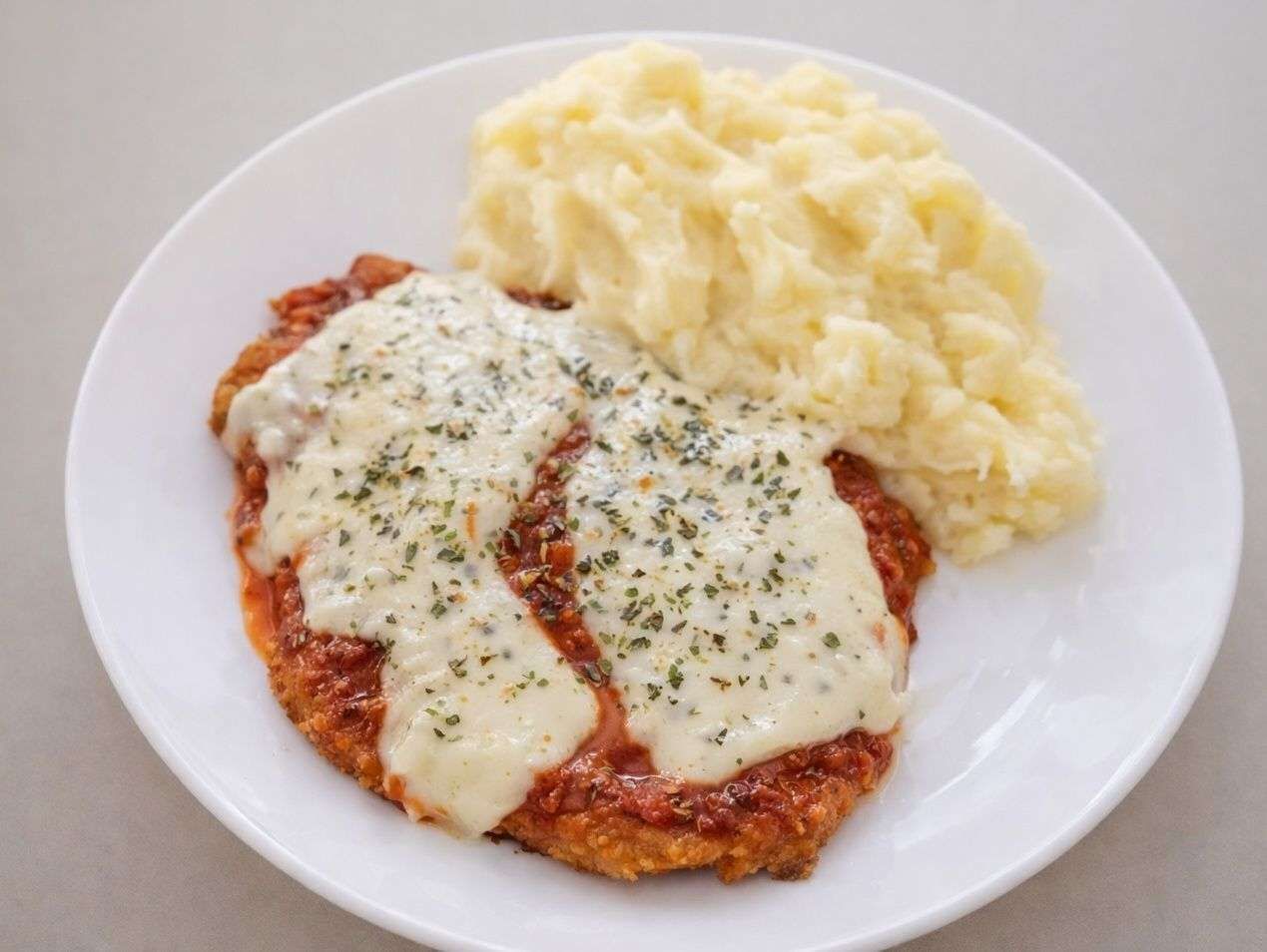 Mila ternera a la pizza + guarnición
